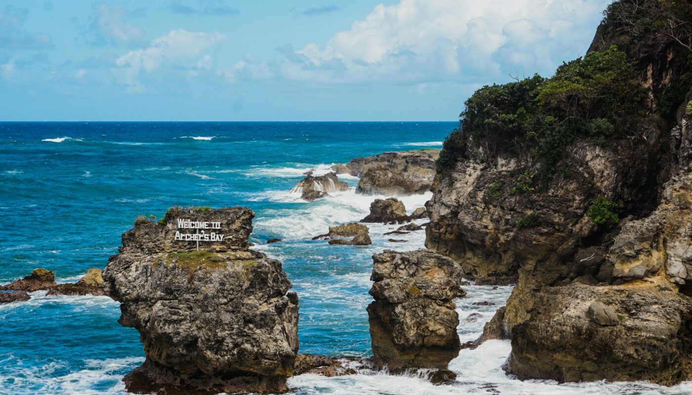 a view of the ocean from a rocky cliff